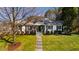 Charming home with a well-manicured lawn and inviting front porch and a path to the front door at 508 Currituck Dr, Raleigh, NC 27609