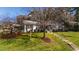 Exterior view of home with a lawn, landscaped yard, and pathway leading to the entrance at 508 Currituck Dr, Raleigh, NC 27609