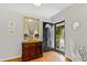 Inviting foyer with beautiful hardwood floors, traditional furniture, and view to front yard at 508 Currituck Dr, Raleigh, NC 27609