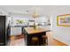Well-equipped kitchen featuring white cabinets, a butcher block island, and stainless steel appliances at 508 Currituck Dr, Raleigh, NC 27609