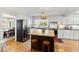 Charming kitchen with white cabinets, a butcher block island, and stainless steel appliances at 508 Currituck Dr, Raleigh, NC 27609