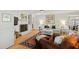 Inviting living room showcasing a white brick fireplace, hardwood floors, and comfortable seating at 508 Currituck Dr, Raleigh, NC 27609