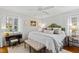 Bright, airy main bedroom featuring a plush bed, neutral tones, and abundant natural light at 508 Currituck Dr, Raleigh, NC 27609