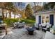 Patio with outdoor seating, fire pit, grill, and cafe lighting at 508 Currituck Dr, Raleigh, NC 27609