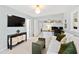 Sitting room with modern lighting, a comfortable white sofa, and built in shelving at 508 Currituck Dr, Raleigh, NC 27609