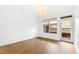 Bright bedroom with plank floors, modern lighting, and a balcony entrance at 510 Glenwood Ave # 602, Raleigh, NC 27603