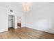 Open bedroom with decorative lighting and views to closet and bathroom at 510 Glenwood Ave # 602, Raleigh, NC 27603