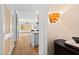 Open hallway leading to kitchen and living area with decorative lighting at 510 Glenwood Ave # 602, Raleigh, NC 27603