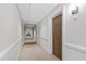 Hallway leading to apartments with neutral wall colors and carpet at 510 Glenwood Ave # 602, Raleigh, NC 27603
