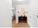 Hallway features light plank floors and a decorative alcove with lighting at 510 Glenwood Ave # 602, Raleigh, NC 27603