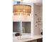 Close up of a kitchen quartz countertop island and faucet with a stylish chandelier above at 510 Glenwood Ave # 602, Raleigh, NC 27603