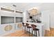 Stylish kitchen with modern chandelier and breakfast bar at 510 Glenwood Ave # 602, Raleigh, NC 27603