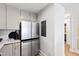 Stainless steel refrigerator and cabinets in modern kitchen design at 510 Glenwood Ave # 602, Raleigh, NC 27603