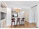 Bright kitchen with an island, barstool seating, and modern lighting fixtures at 510 Glenwood Ave # 602, Raleigh, NC 27603