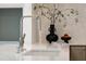 Close-up of a kitchen sink, faucet, decor, and mosaic backsplash tiles at 510 Glenwood Ave # 602, Raleigh, NC 27603