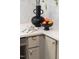 Modern kitchen features a quartz countertop island with modern black decorations and fruit at 510 Glenwood Ave # 602, Raleigh, NC 27603