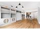 Living room with hardwood floors, built in shelving and breakfast bar at 510 Glenwood Ave # 602, Raleigh, NC 27603