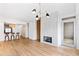 Living room with hardwood floors, fireplace, breakfast bar and modern chandelier at 510 Glenwood Ave # 602, Raleigh, NC 27603