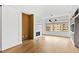 Living room with hardwood floors, modern fireplace and large window at 510 Glenwood Ave # 602, Raleigh, NC 27603