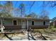 Charming single-story home featuring a brick foundation, light green siding, and a welcoming front entrance at 529 Solar Dr Dr, Raleigh, NC 27610