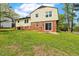 Grassy backyard with patio and mature trees provide an outdoor retreat at 5401 Kaplan Dr, Raleigh, NC 27606