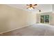 Finished basement with sliding glass door and paneled walls at 5401 Kaplan Dr, Raleigh, NC 27606