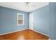 Bedroom featuring hardwood floors and neutral colored walls at 5401 Kaplan Dr, Raleigh, NC 27606