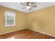 Bedroom featuring hardwood floors and a window for natural light at 5401 Kaplan Dr, Raleigh, NC 27606
