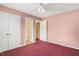 Bedroom featuring pink walls and red carpet at 5401 Kaplan Dr, Raleigh, NC 27606