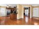 Open kitchen with hardwood floors, stainless steel appliances, and wooden cabinets at 5401 Kaplan Dr, Raleigh, NC 27606