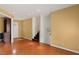 Open concept living room featuring wood floors and stairs to the second floor at 5401 Kaplan Dr, Raleigh, NC 27606