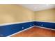 Cozy room featuring hardwood floors, wainscoting and neutral paint and ample electrical outlets at 5401 Kaplan Dr, Raleigh, NC 27606