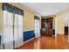 Bright living room with hardwood floors, natural light, and stylish built-in shelving at 5401 Kaplan Dr, Raleigh, NC 27606