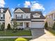 Charming two-story home with a well-manicured lawn and attached two car garage at 6 S Summerhill Rdg, Clayton, NC 27520