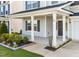 Welcoming front porch with classic columns and manicured landscaping at 6 S Summerhill Rdg, Clayton, NC 27520
