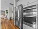 Open-concept kitchen featuring stainless steel appliances, wooden floors, and great views at 6 S Summerhill Rdg, Clayton, NC 27520