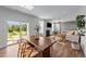 Open floor plan living area featuring natural lighting, hardwood floors, and a fireplace at 6 S Summerhill Rdg, Clayton, NC 27520