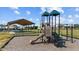 Community playground with slides, climbing structures, and a covered picnic area at 6 S Summerhill Rdg, Clayton, NC 27520