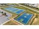 Aerial view of tennis courts and basketball court next to parking at 6 S Summerhill Rdg, Clayton, NC 27520