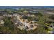 Expansive aerial view of a residential community featuring lush landscaping and well-maintained homes at 609 Meyers Place Ln, Holly Springs, NC 27540