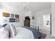 Modern bedroom featuring a sleek bed, decorative wall art, and ample natural light at 609 Meyers Place Ln, Holly Springs, NC 27540