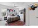 Well-decorated bedroom with pennant decor and a sleek, modern design, offering a comfortable and personalized space at 609 Meyers Place Ln, Holly Springs, NC 27540