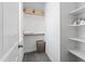 Walk-in closet with built-in shelves and hanging space, providing ample storage solutions at 609 Meyers Place Ln, Holly Springs, NC 27540