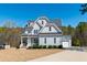 Beautiful exterior with a manicured lawn at 609 Meyers Place Ln, Holly Springs, NC 27540