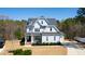 Charming two-story home with manicured lawn, attractive landscaping, and a beautiful, classic architectural design at 609 Meyers Place Ln, Holly Springs, NC 27540