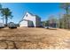 Exterior of home showing the spacious backyard at 609 Meyers Place Ln, Holly Springs, NC 27540