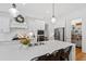 Spacious kitchen island provides extra seating and prep space, complemented by modern appliances and fixtures at 609 Meyers Place Ln, Holly Springs, NC 27540