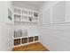This mudroom provides organized storage with built-in shelving, bench, and woven baskets at 609 Meyers Place Ln, Holly Springs, NC 27540