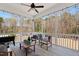 Cozy screened porch with wood floors, ceiling fan, and lovely views of the wooded backyard at 609 Meyers Place Ln, Holly Springs, NC 27540
