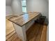 A well-appointed bar with a refrigerator and storage space provides entertaining convenience at 65 Oglethorpe Ave, Clayton, NC 27527